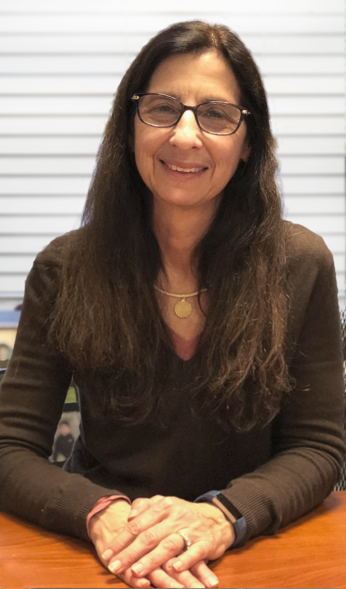 Lisa Chiarello, PhD seated in office